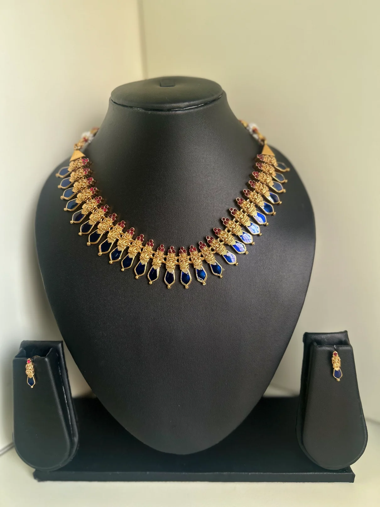 Antique gold Lakshmi and leaf drop palaka necklace set in navy blue - S-cube Fashions