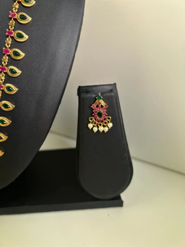 Antique gold palaka haram set in green and red stones