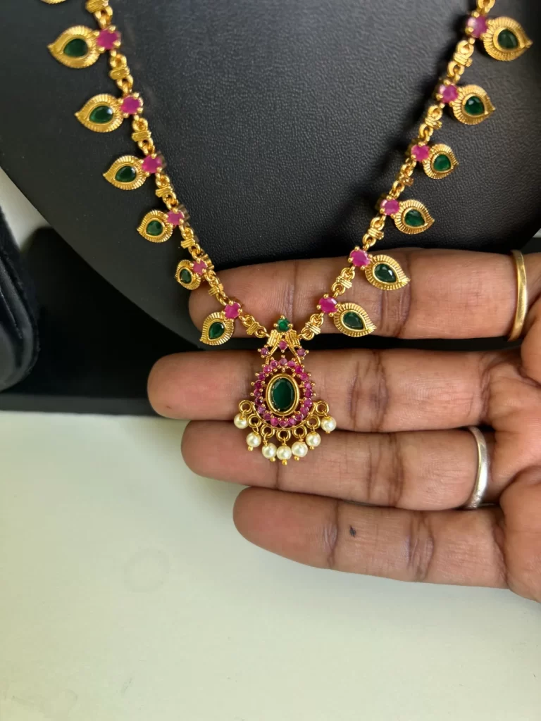 Antique gold palaka haram set in green and red stones