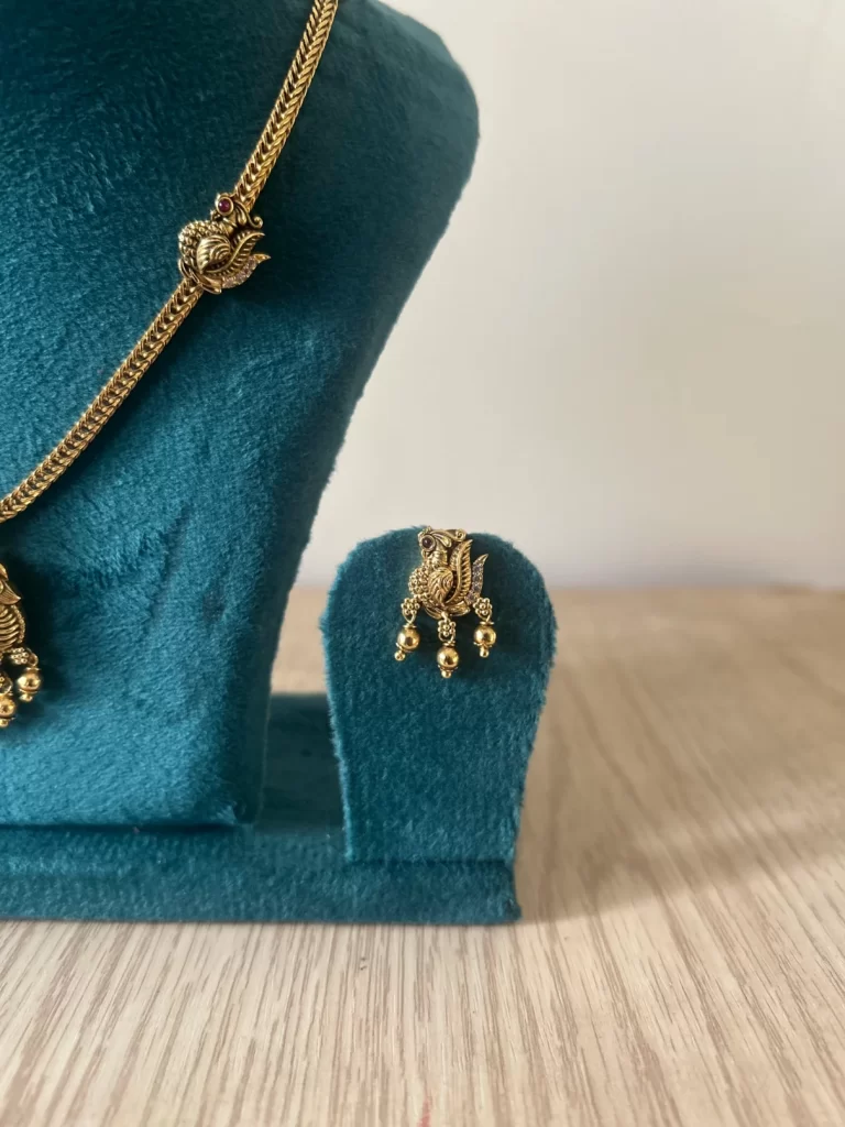 Antique gold peacock necklace set with ruby pendant and matching drop earrings – S-cube Fashions