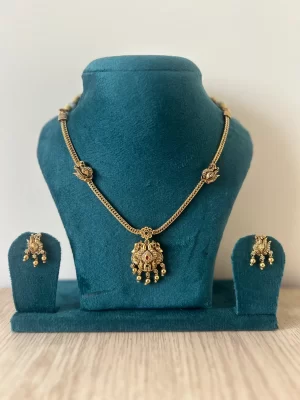 Antique gold peacock necklace set with ruby pendant and matching drop earrings – S-cube Fashions
