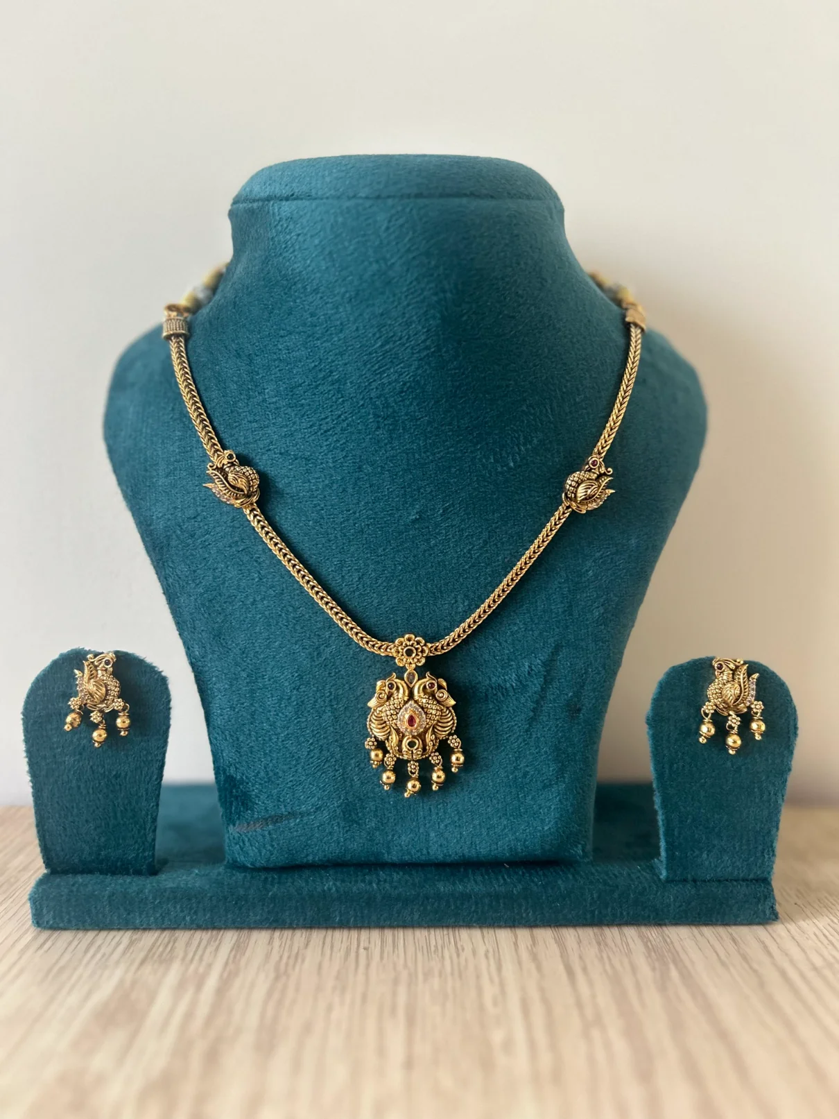 Antique gold peacock necklace set with ruby pendant and matching drop earrings – S-cube Fashions