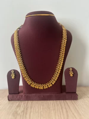 Gold look-alike Lakshmi coin mid length haram set with matching earrings - S-cube Fashions & Jewellery