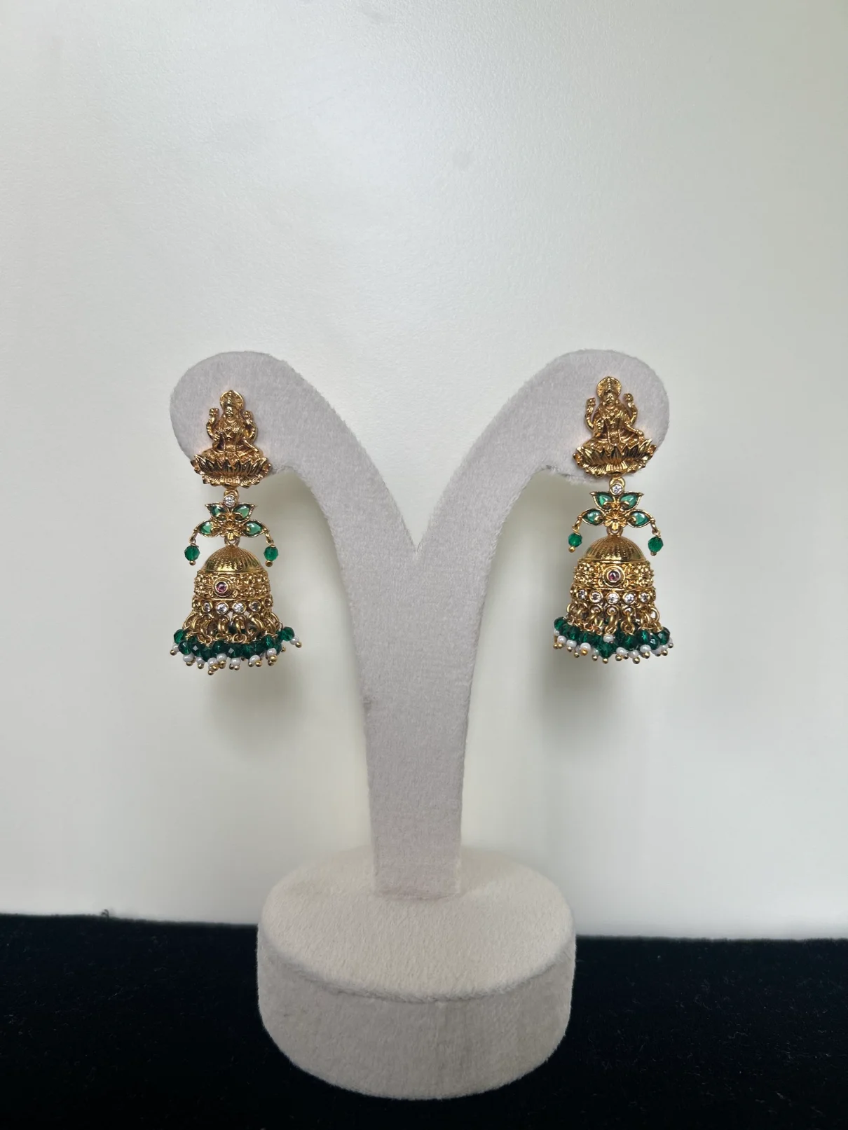 Antique gold Lakshmi devi jhumka earrings with green bead drops - S-cube Fashions