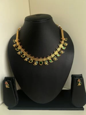 Antique gold Lakshmi and leaf drop palaka necklace set style 3 in dark green - S-cube Fashions