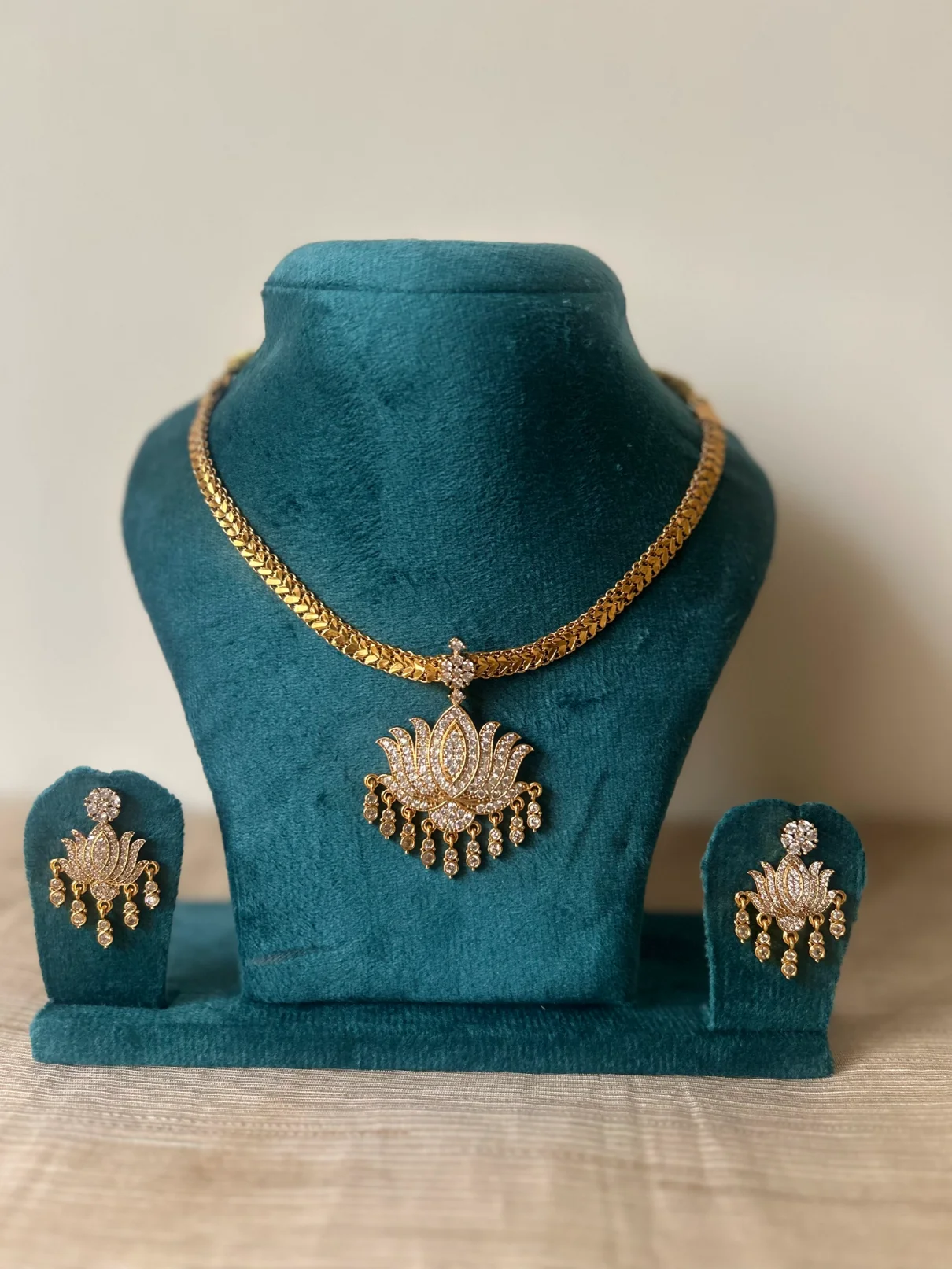 Gold-toned lotus attigai necklace set with CZ pendant and pearl fringe - S-cube Fashions