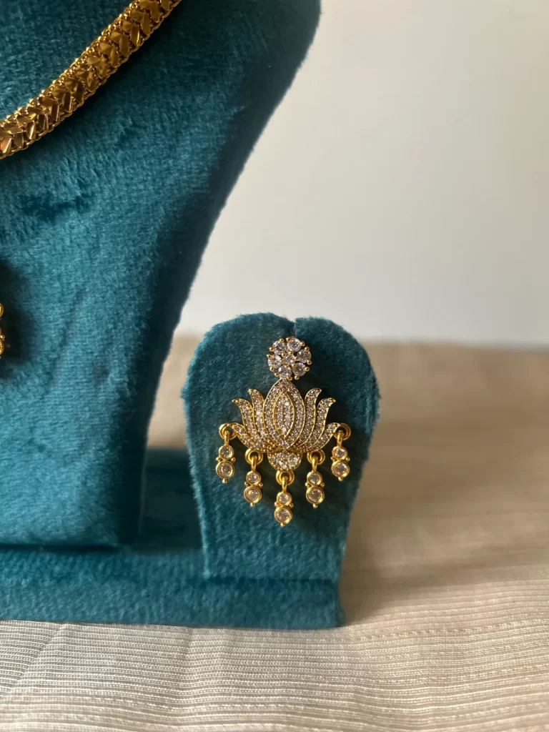 Gold-toned lotus attigai necklace set with CZ pendant and pearl fringe - S-cube Fashions