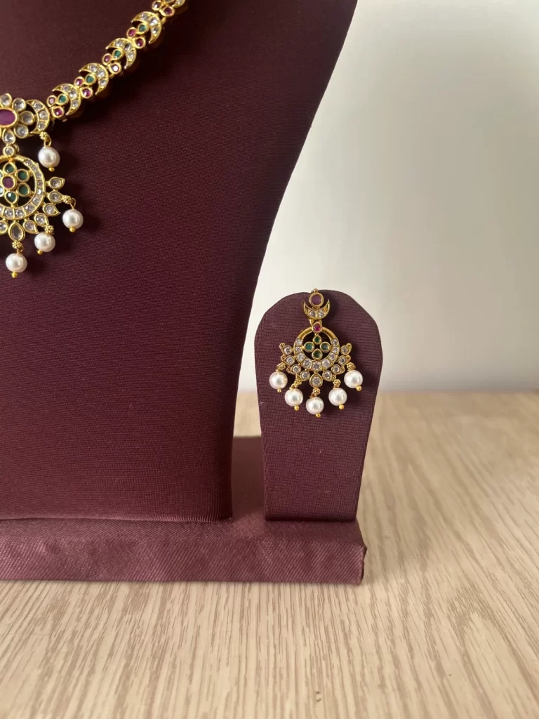 Non-idol gold look-alike pearl drop necklace set with sunburst pendant - S-cube Fashions