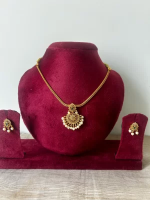 Gold-toned premium attigai necklace set with emerald accent and pearl fringe - S-cube Fashions