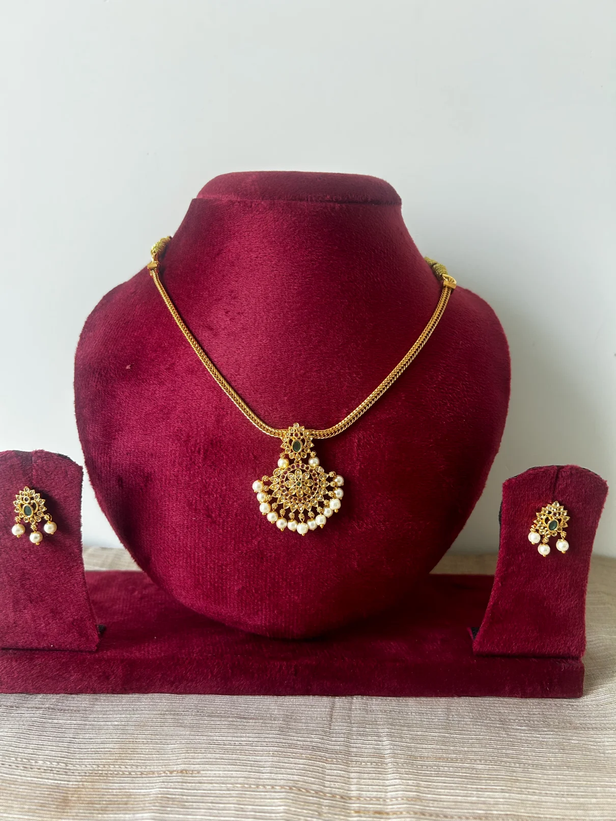 Gold-toned premium attigai necklace set with emerald accent and pearl fringe - S-cube Fashions