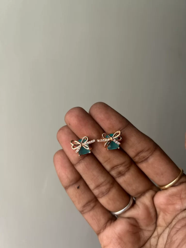 Rosegold bow stud earrings with mint green stone